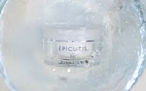 A close up of the epicutis logo on some kind of cream