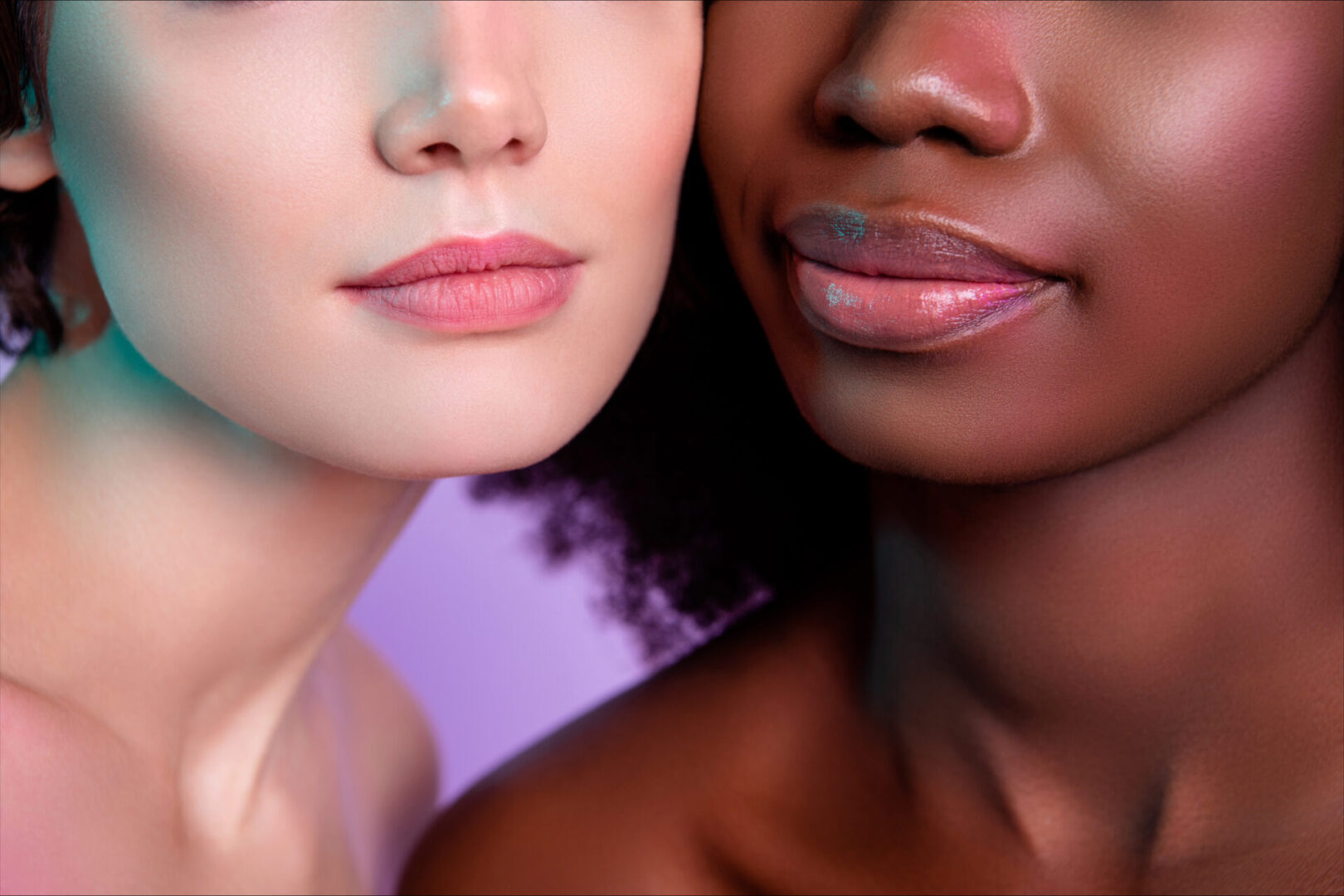 Two women with different skin tones and one is white